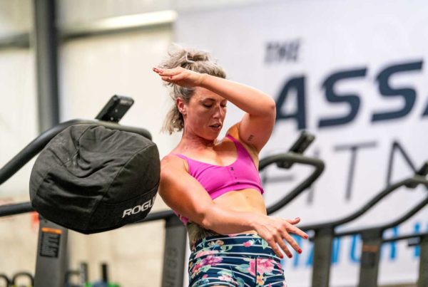 Woman throwing a sandbag at the 2019 CrossFit Games